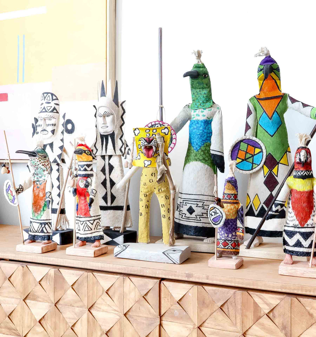 Traditional Ticuna woven dolls and hand-carved cocobolo spirit figures, Indigenous art forms from Colombia and Panama featured in the RFB Woven Art collection