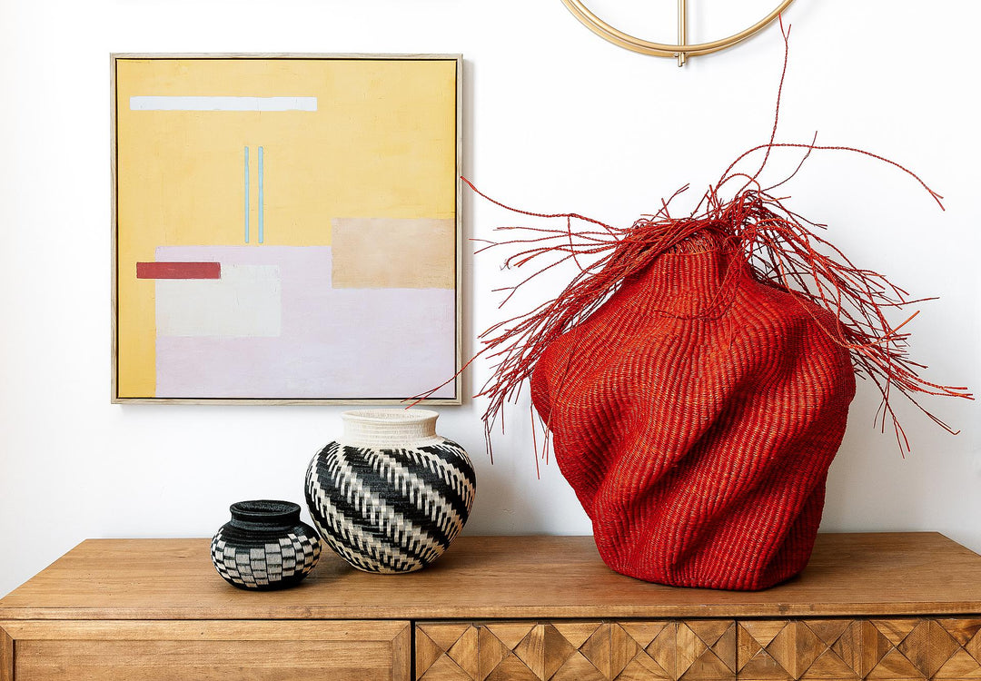 Assorted woven baskets, animal masks, decorative plates, and carvings by traditional artists from Panama, Colombia, and beyond — full RFB Woven Art collection display