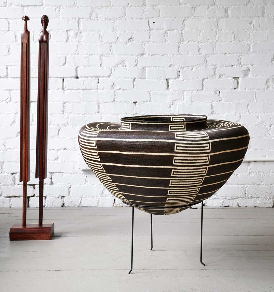 Oversized woven basket and sculptural tribal mask displayed as statement art, handmade by Indigenous artists — RFB Woven Art collection