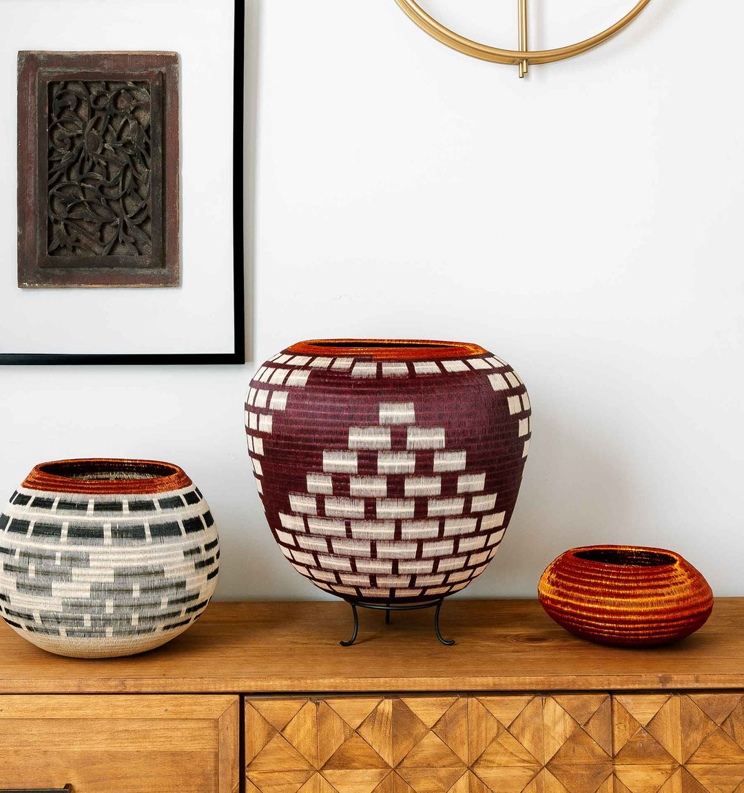Colombian Wounaan basket handwoven with palm fiber and copper wire, featuring bold coils and symbolic design — RFB Woven Art collection