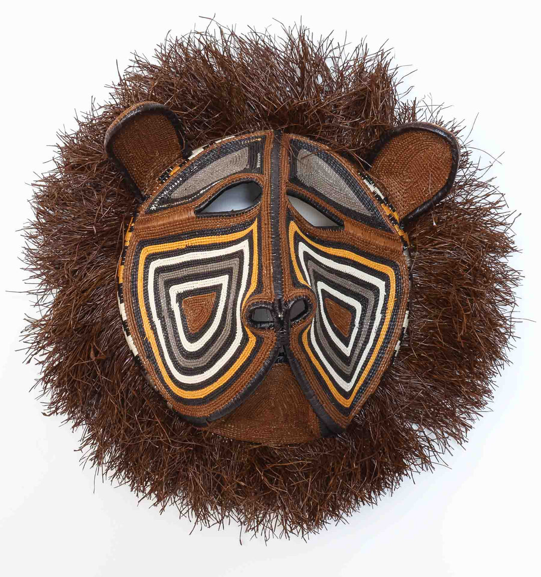 Guardian Cat Mask, 16" woven art by Embera weaver Felicinda Guaynora, Panama palm fiber feline mask with concentric design and shaggy fiber mane.