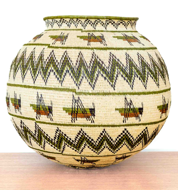 Full front view of Wounaan basket with rows of grasshopper motifs and zigzag borders.