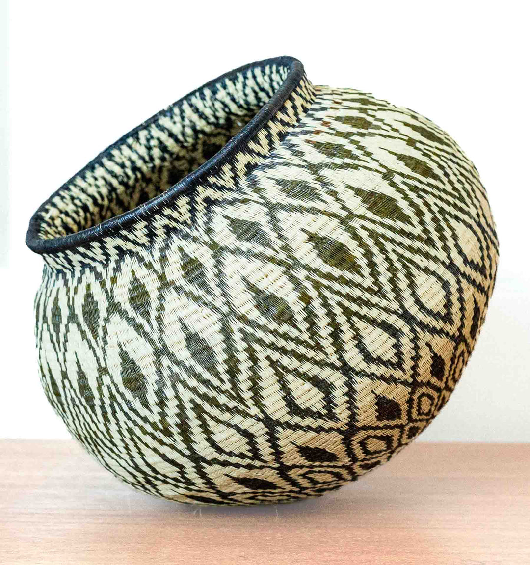 Side view showing geometric diamond motifs in natural palm fiber weave