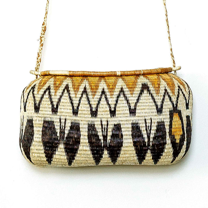 Handwoven Wounaan basket purse with golden peak and dark brown zigzag design, Panama