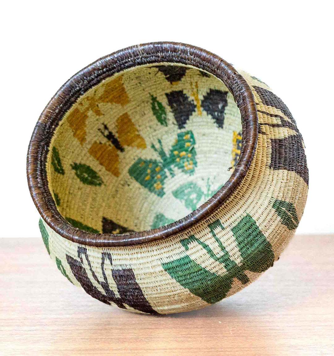 Interior of butterfly basket showing multiple butterflies in natural dyed colors