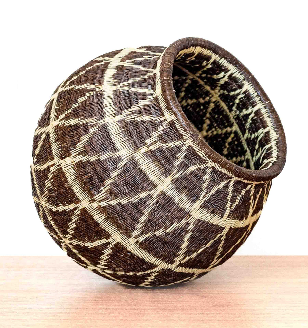 Side view of large Wounaan basket with geometric diamond lattice pattern