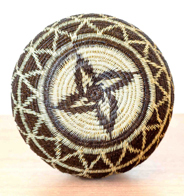 Starlight Whirl basket featuring spiral star motif on base